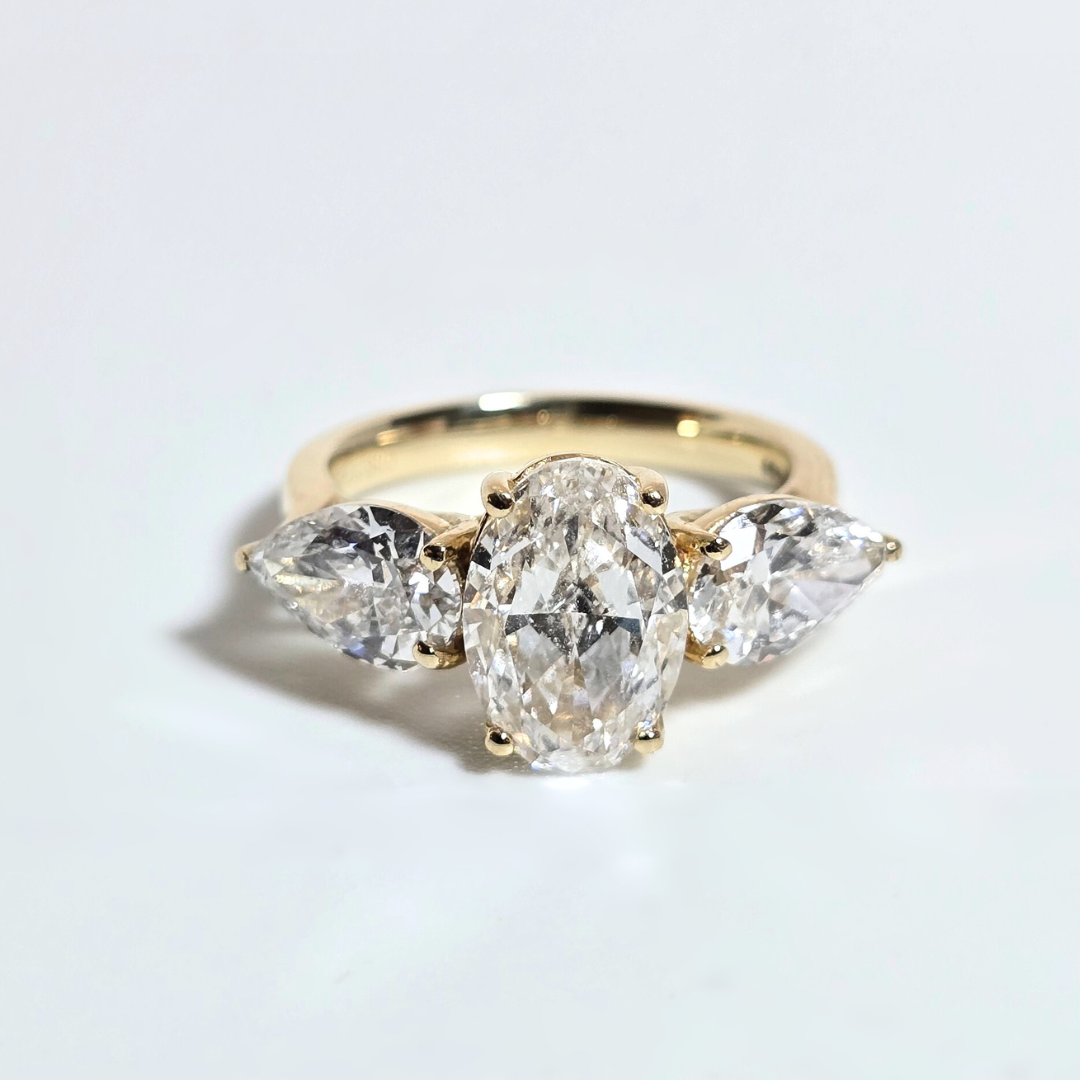 5.00ct Oval Cut Lab Grown Diamond Trilogy Ring with Pear Side Stones in 14ct Yellow Gold