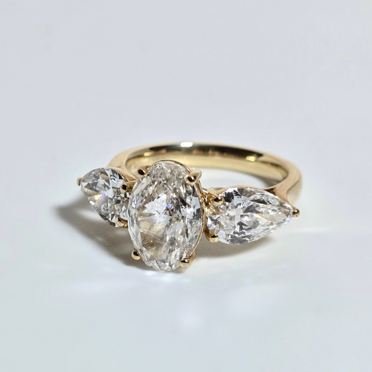 5.00ct Oval Cut Lab Grown Diamond Trilogy Ring with Pear Side Stones in 14ct Yellow Gold