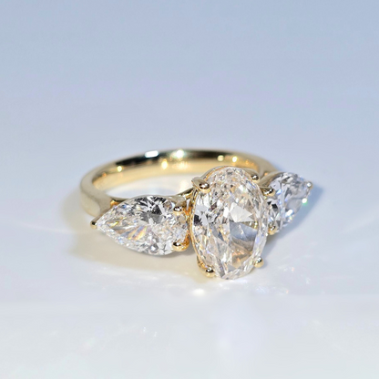 5.00ct Oval Cut Lab Grown Diamond Trilogy Ring with Pear Side Stones in 14ct Yellow Gold
