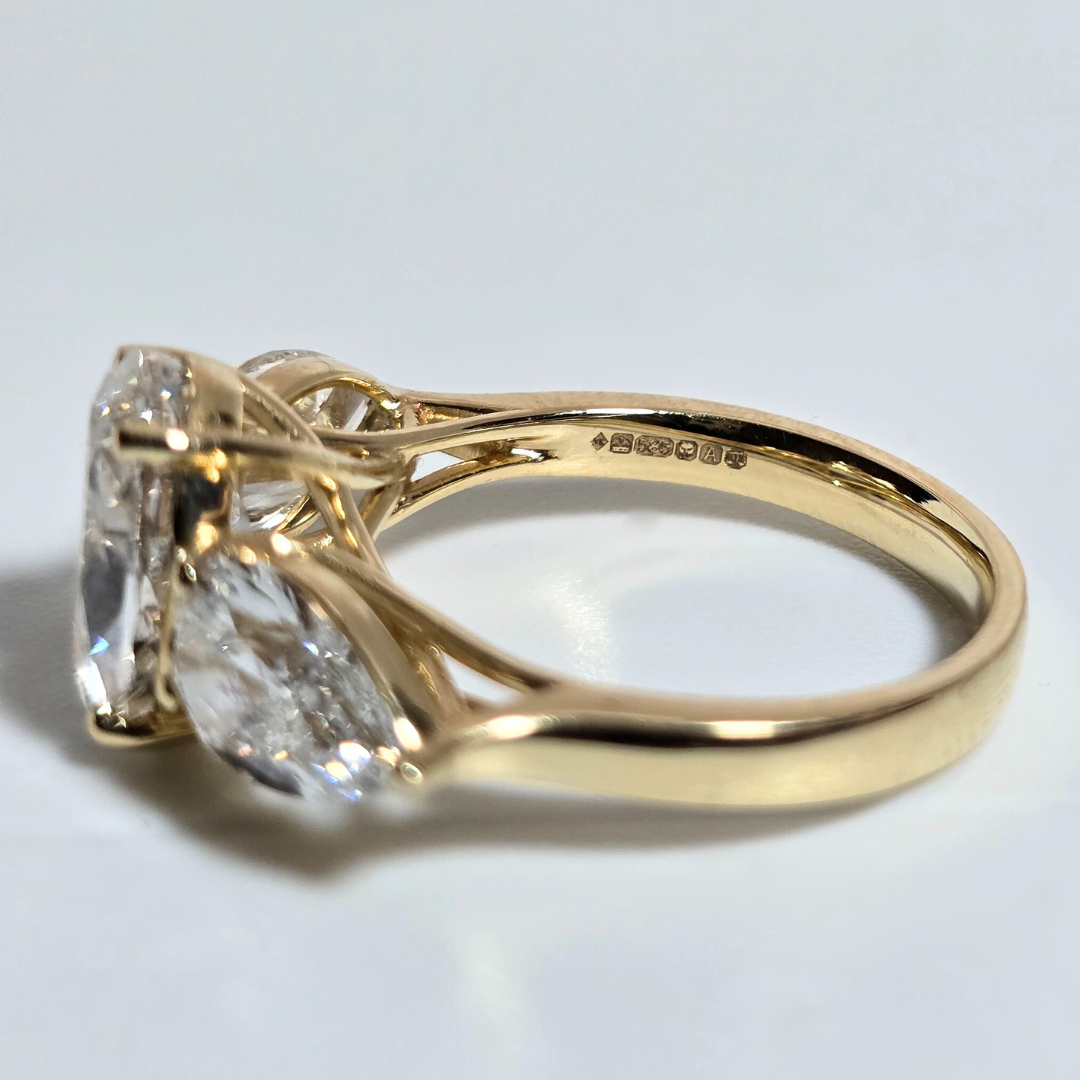 5.00ct Oval Cut Lab Grown Diamond Trilogy Ring with Pear Side Stones in 14ct Yellow Gold