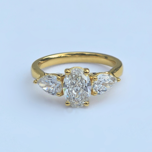 Gold ring with three lab grown diamonds oval & pear shaped 