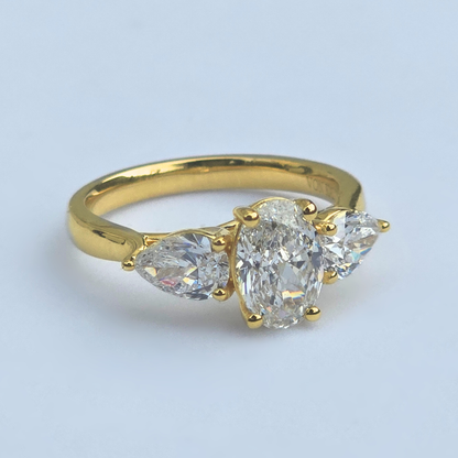 Gold ring with three lab grown diamonds oval & peart shaped side right