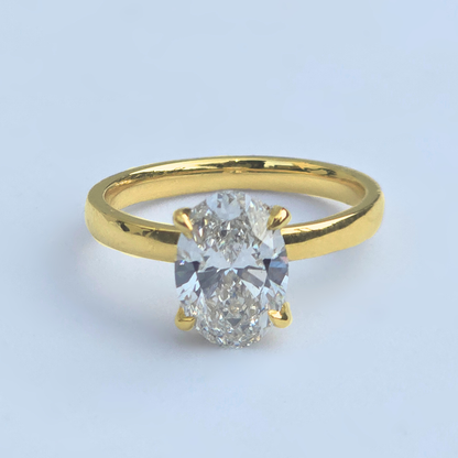 2.13ct oval lab grown diamond solitaire ring with accents in 14ct yellow gold
