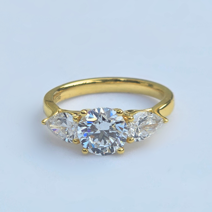 2.52ct round lab grown diamond three stone ring in 14ct yellow gold