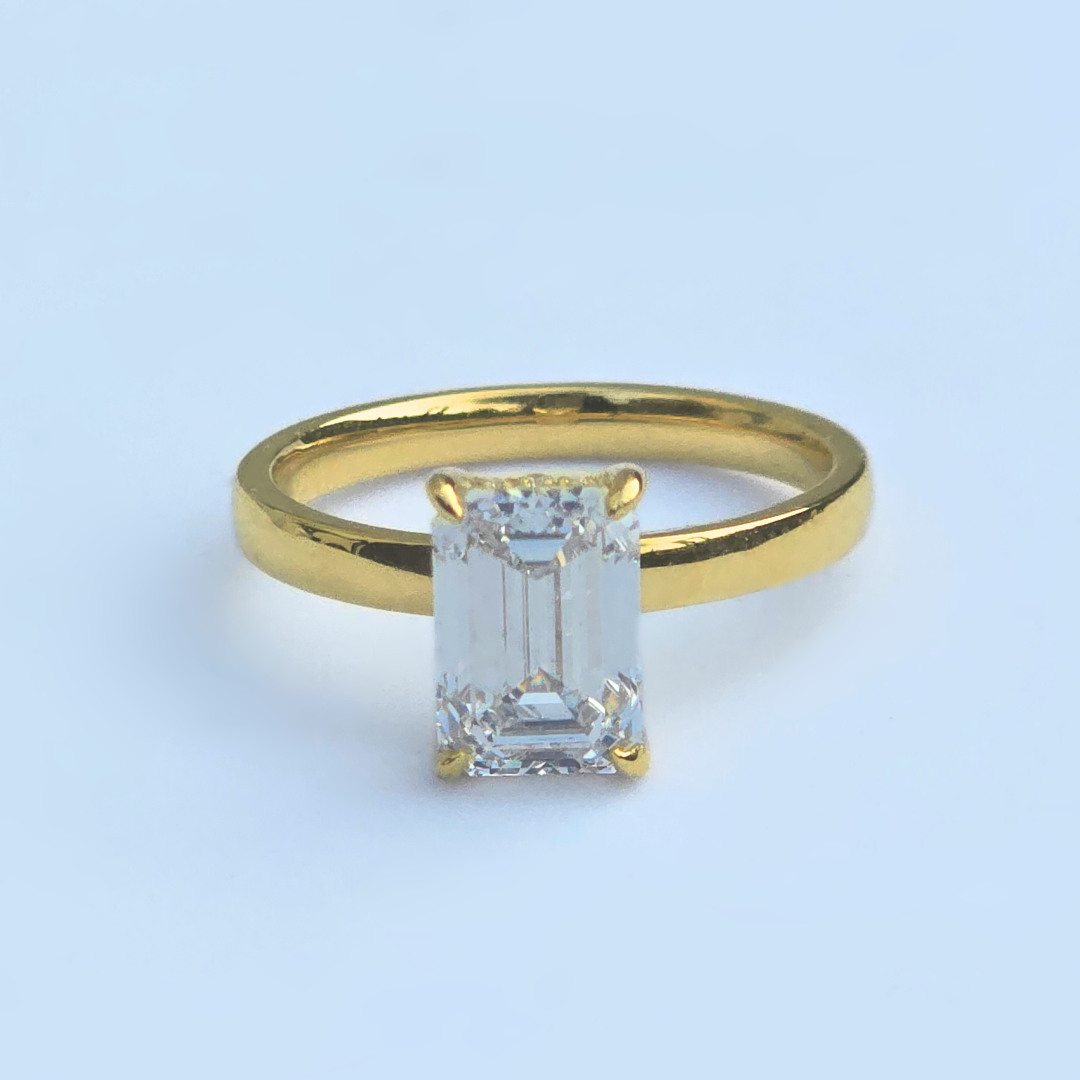 2.18ct emerald cut lab-grown diamond ring in 14ct yellow gold, front view, F colour VS1 clarity, IGI certified